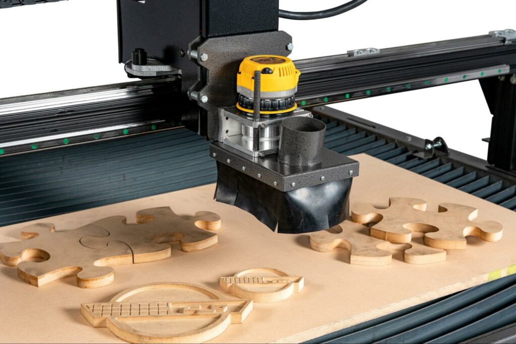 A cnc router carving intricate designs on a wooden surface