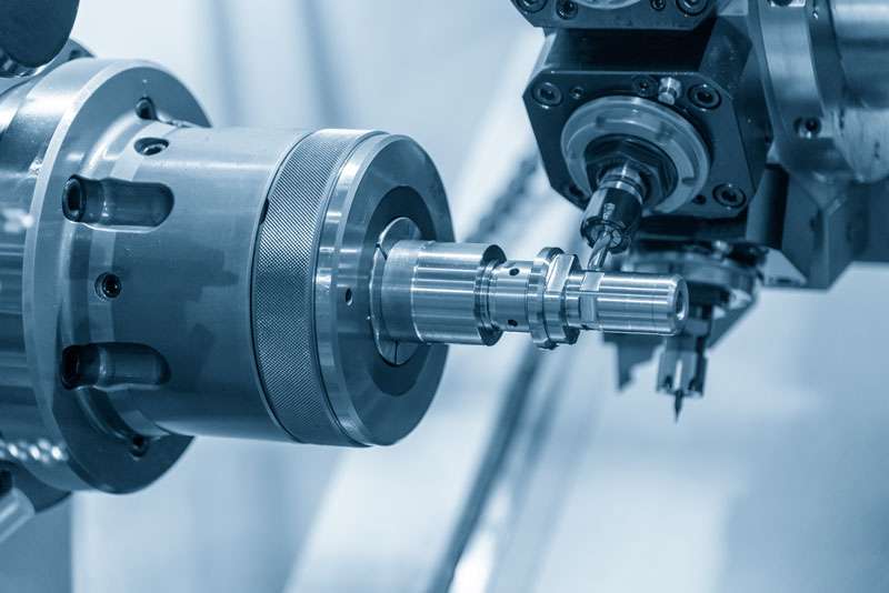 A cnc turning machine crafting cylindrical parts from a metal workpiece