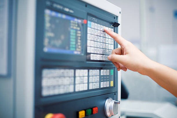 Close up of a cnc control panel with buttons and screens for programming