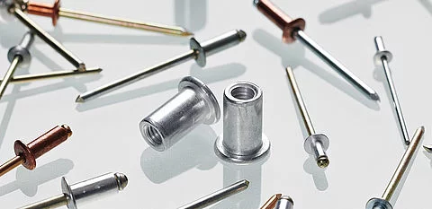An aluminum rivet depicted, showcasing its lightweight and corrosion resistant properties